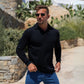 Man wearing muscle fit long sleeve polo black open collar