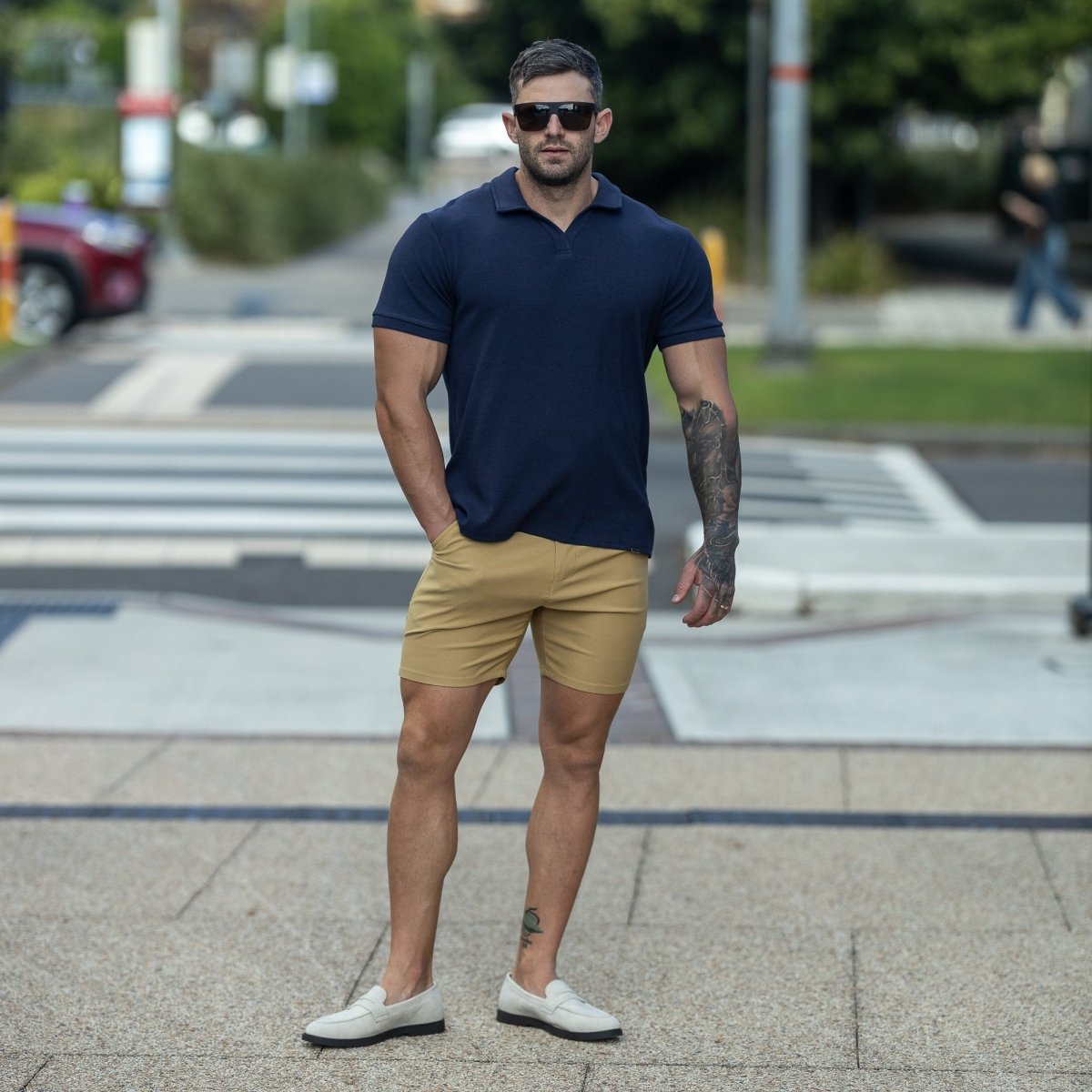 Stylish Summer Outfits for men who lift Navy Polo with Brown Chino Shorts